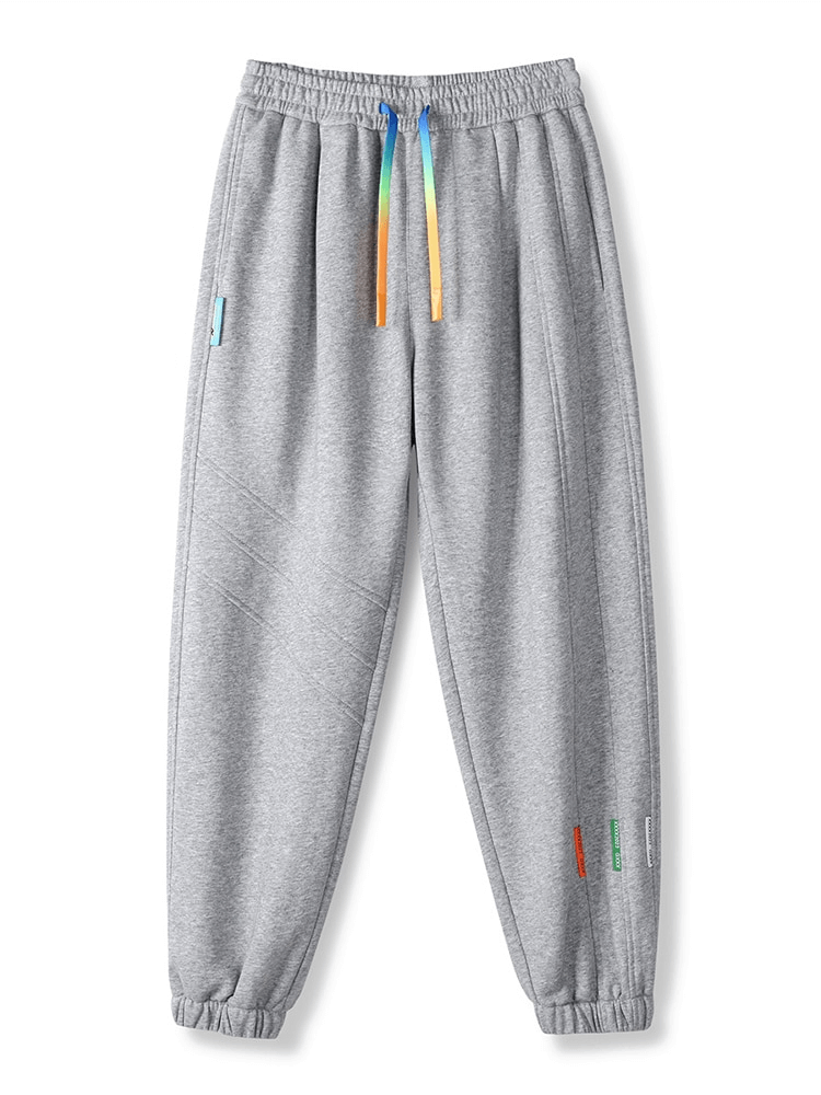 Sporty baggy casual joggers for men with side pockets in gray, featuring a loose fit, drawstring waist, and flat-front style - SF1427